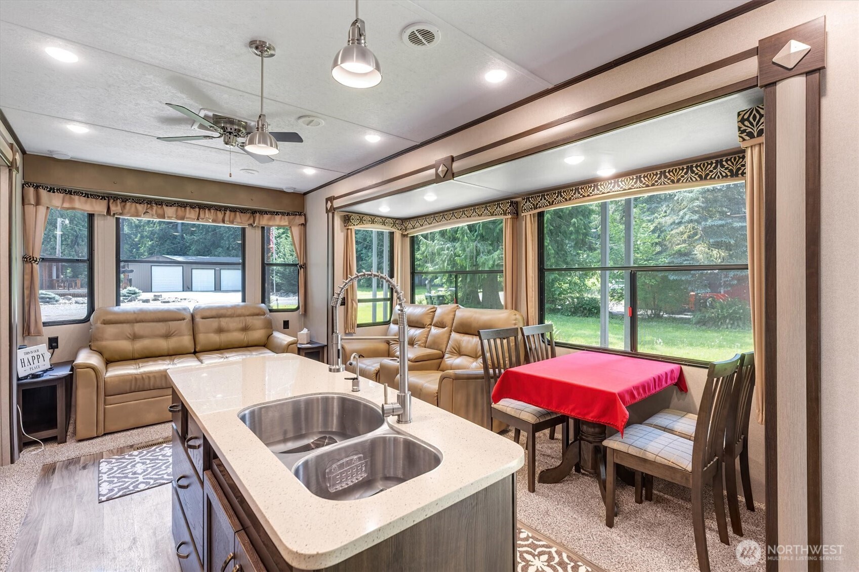 304 Winston Creek Road, Unit B10L3 Mossyrock, WA 98564 - Photo 5 of 30 a kitchen that has a sink and a table with chairs