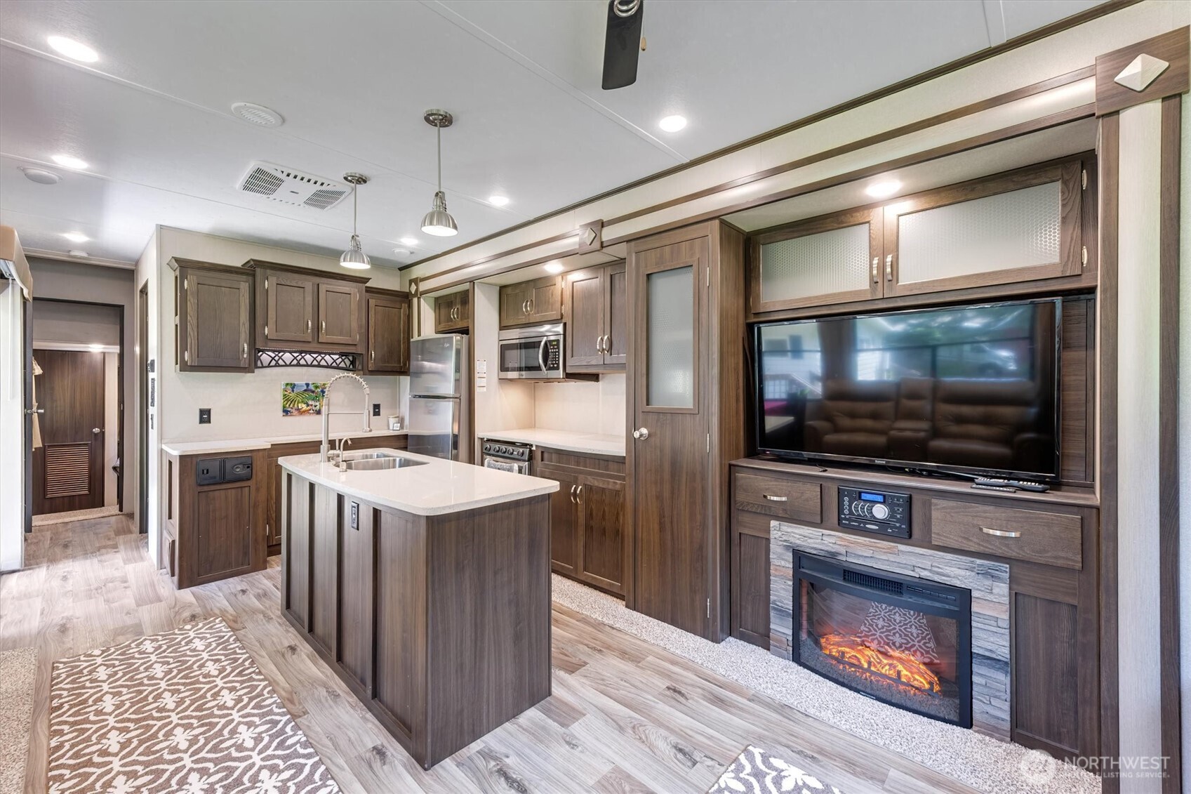 304 Winston Creek Road, Unit B10L3 Mossyrock, WA 98564 - Photo 6 of 30 a kitchen with kitchen island a sink stainless steel appliances and cabinets