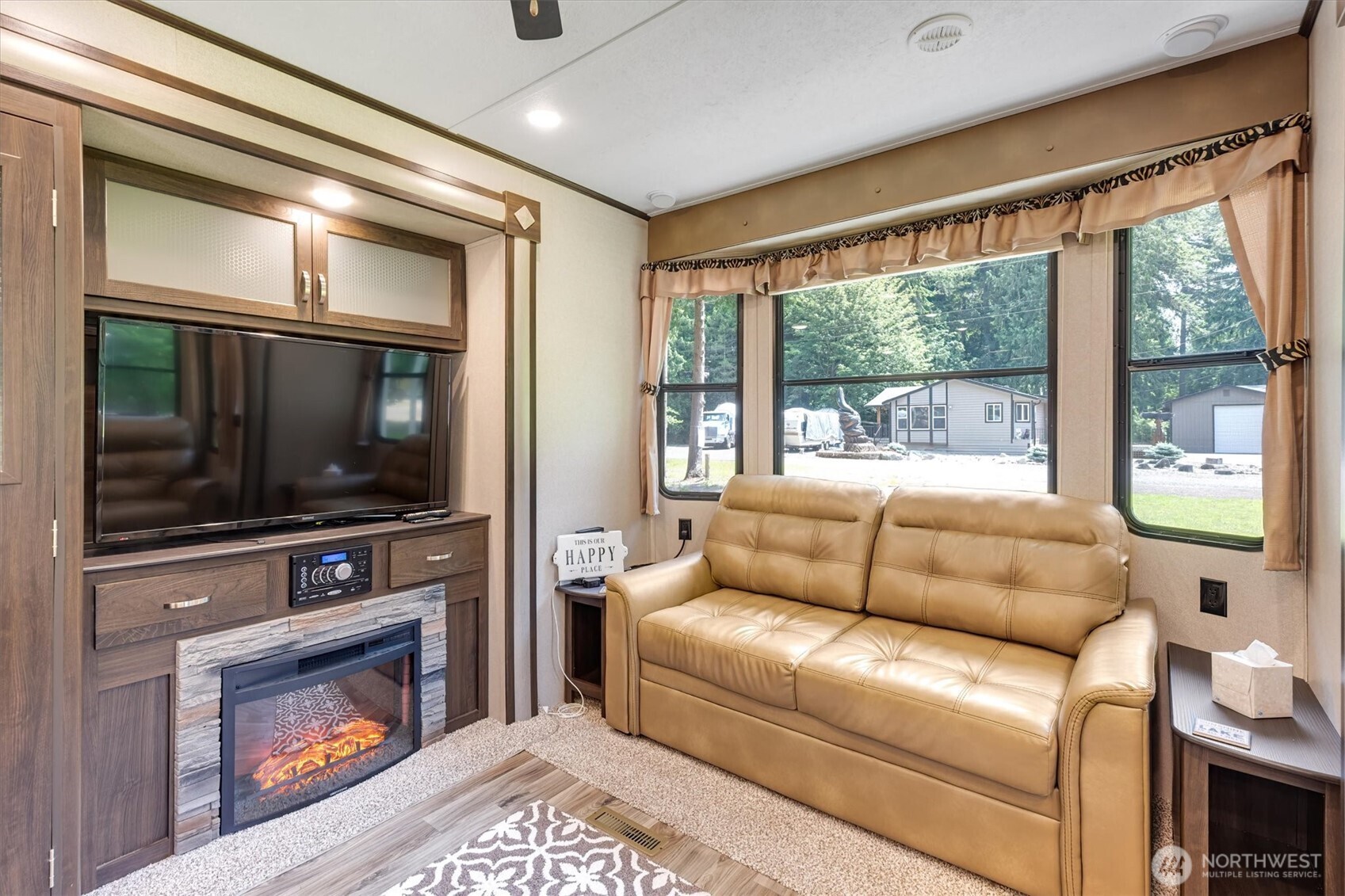 304 Winston Creek Road, Unit B10L3 Mossyrock, WA 98564 - Photo 7 of 30 a living room with furniture a flat screen tv and a fireplace