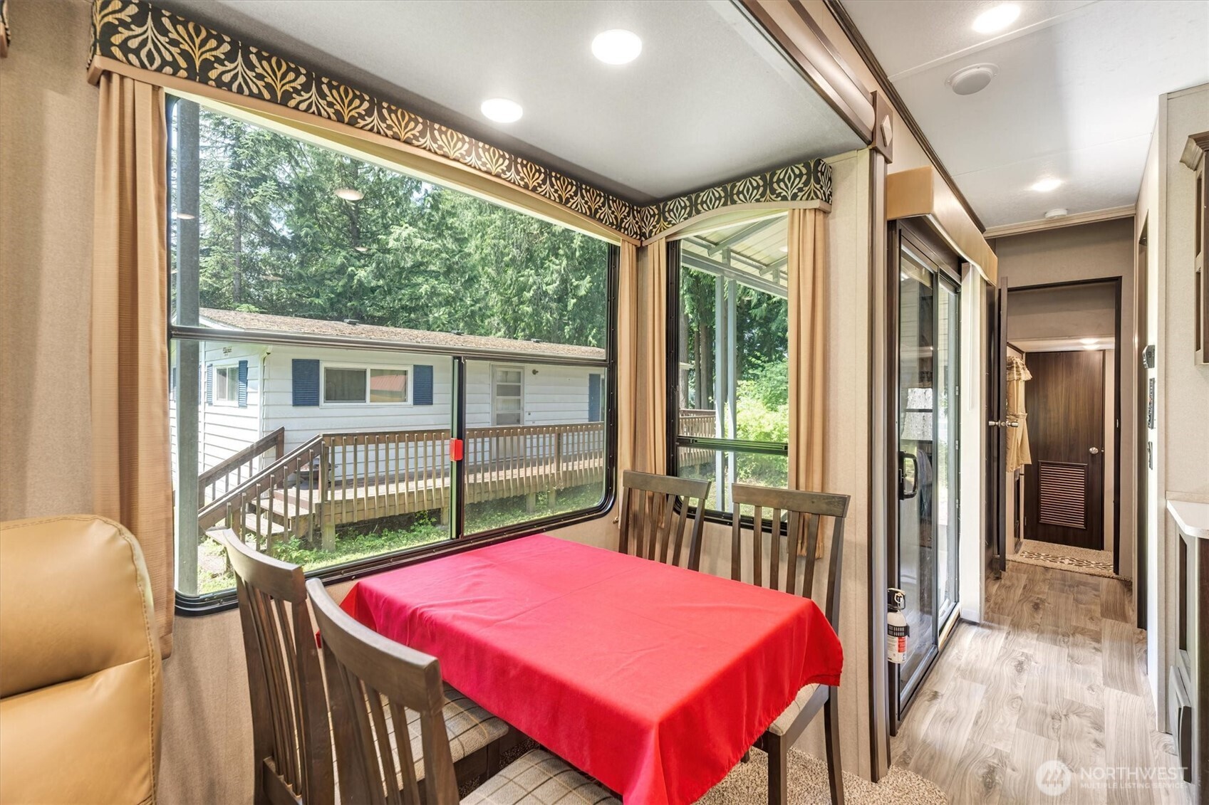 304 Winston Creek Road, Unit B10L3 Mossyrock, WA 98564 - Photo 8 of 30 a balcony with furniture and a table
