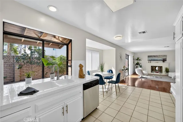 a living room with furniture and large windows