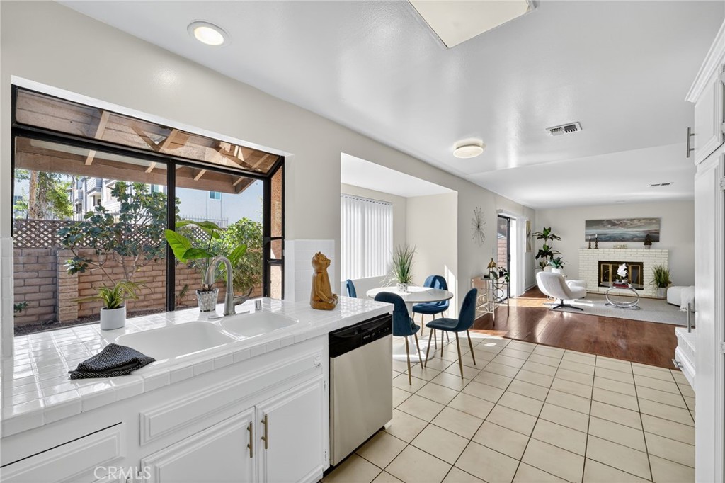 20254 Stagg Street Winnetka, CA 91306 - Photo 13 of 27 a living room with furniture and large windows