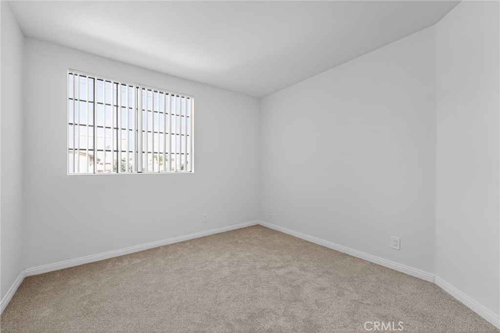 20254 Stagg Street Winnetka, CA 91306 - Photo 25 of 27 an empty room with a window