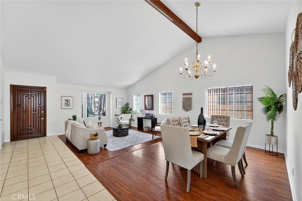 20254 Stagg Street Winnetka, CA 91306 - Photo 4 of 27 a living room with fireplace furniture and a chandelier