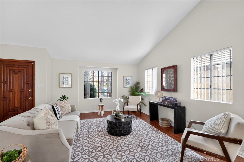 20254 Stagg Street Winnetka, CA 91306 - Photo 5 of 27 a living room with furniture and a large window