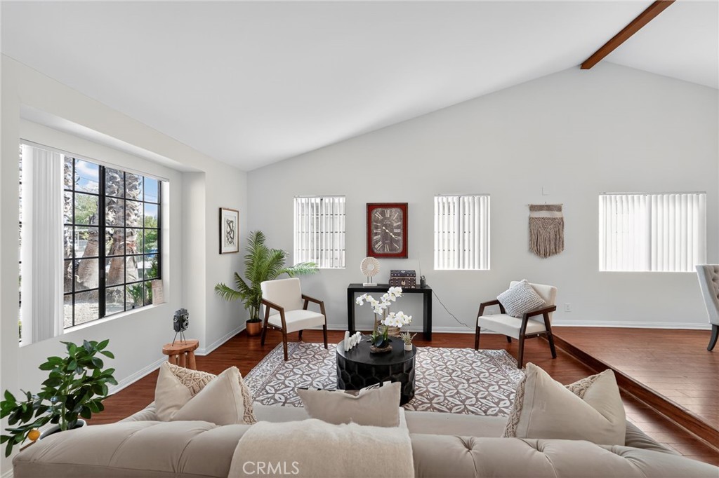20254 Stagg Street Winnetka, CA 91306 - Photo 6 of 27 a living room with furniture or couch and a potted plant