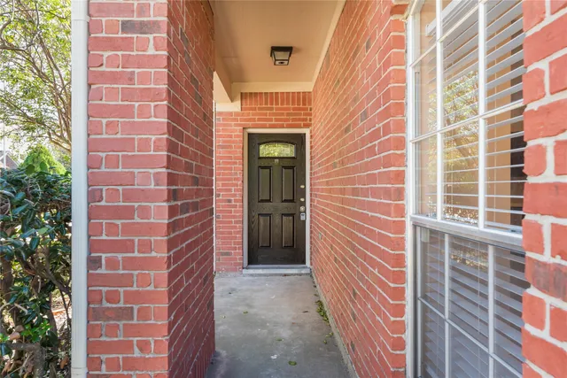 a view of a brick building with many windows