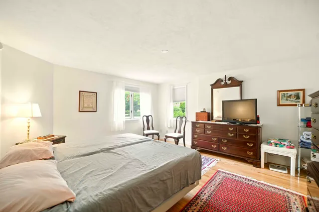 a bedroom with a bed and furniture