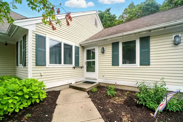 a view of a house with a small garden