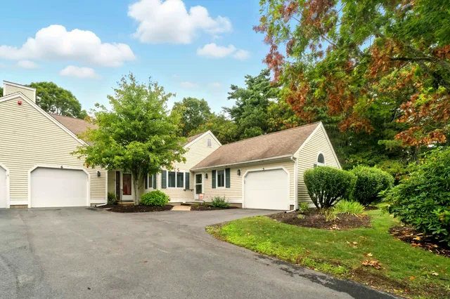 a view of house with outdoor space and garden