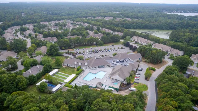 an aerial view of lake residential houses with outdoor space and swimming pool