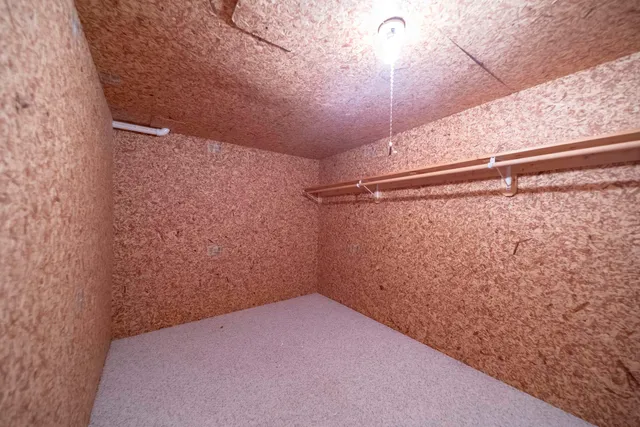 a white toilet sitting next to a bathroom sink