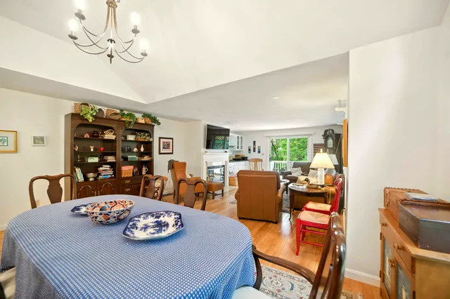 a bedroom with furniture a bed and a chandelier