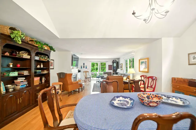 a living room with lots of furniture and wooden floor