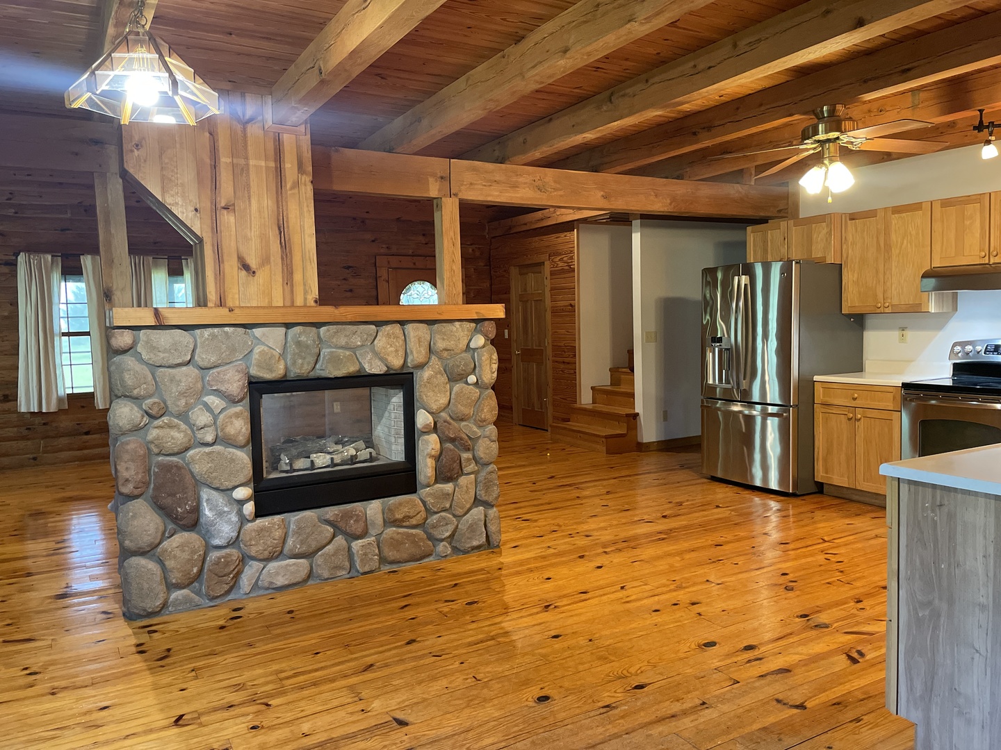 9826 Birkbeck Road Clinton, IL 61727 - Photo 4 of 32 a living room with fireplace furniture and a fireplace