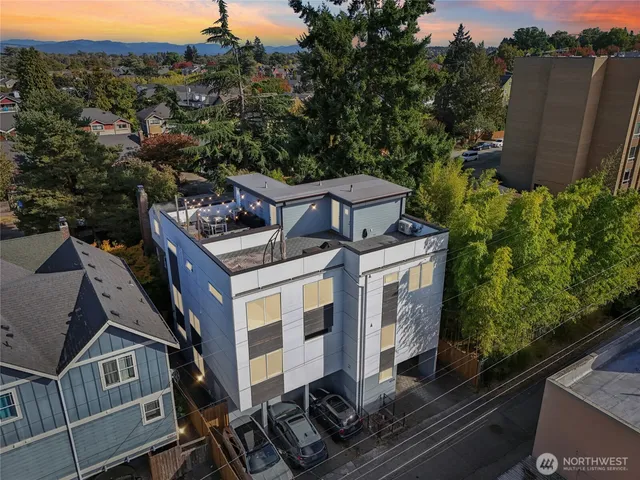 an aerial view of a house with a yard