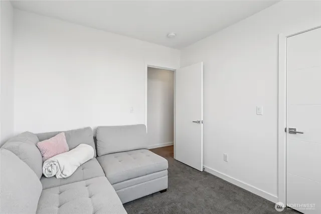 an aerial view of multiple houses with a yard