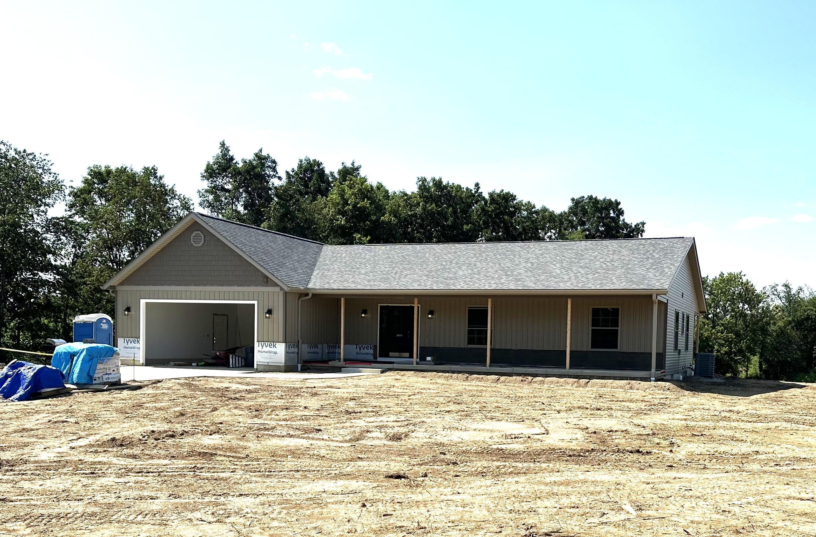 15571 Fairgrounds Road Centerburg, OH 43011 - Photo 2 of 6 Greet friends and neighbors from your covered front porch.