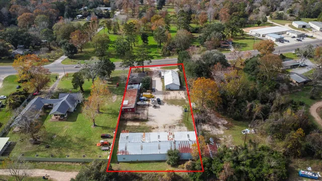 an aerial view of residential houses with outdoor space