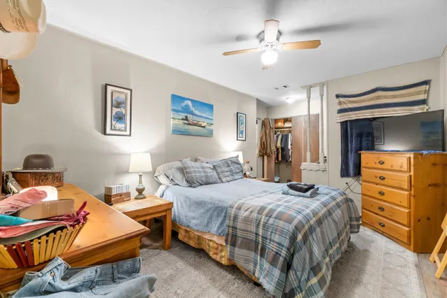 a bathroom with a toilet a sink and curtain