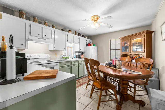 a kitchen with stainless steel appliances a white cabinets and sink