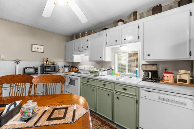 a view of a chairs and table on the wooden floor