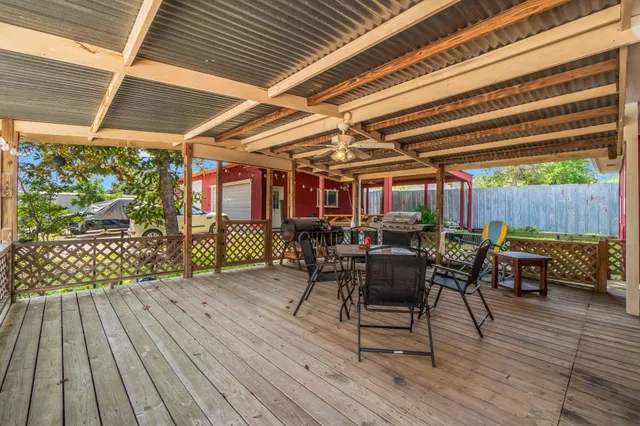 an aerial view of house with yard swimming pool and outdoor seating