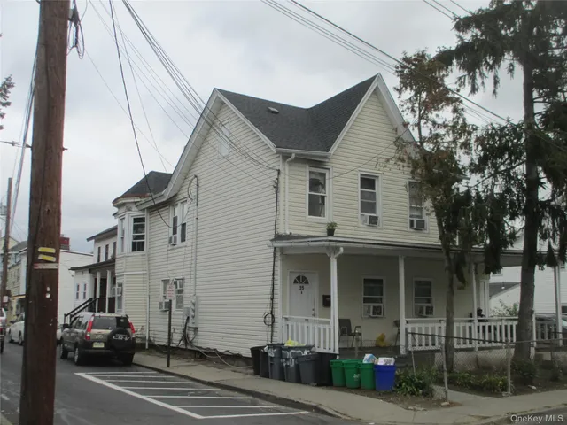 a view of a white apartments with large windows