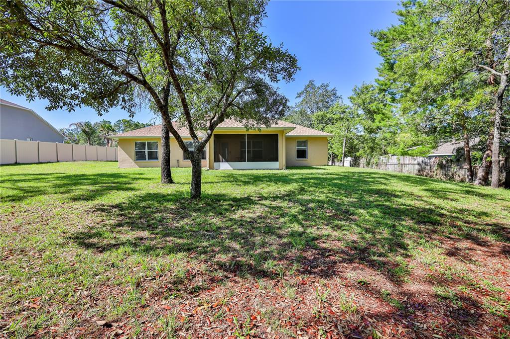 11213 Flock Avenue Weeki Wachee, FL 34613 - Photo 44 of 46 a house view with a garden space