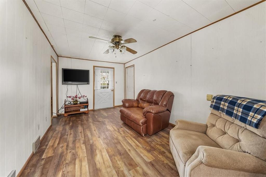 2164 Brodhead Road Aliquippa, PA 15001 - Photo 12 of 28 a living room with furniture and a flat screen tv