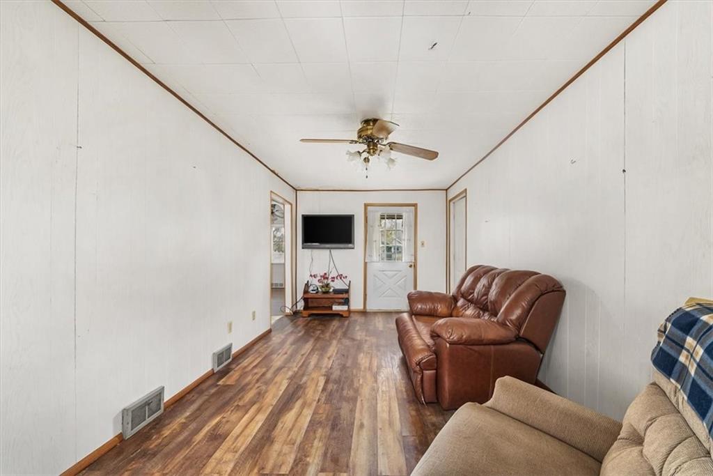 2164 Brodhead Road Aliquippa, PA 15001 - Photo 13 of 28 a living room with furniture a ceiling fan and a rug