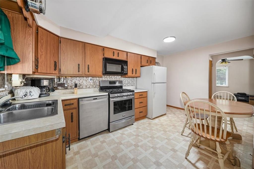 2164 Brodhead Road Aliquippa, PA 15001 - Photo 22 of 28 a kitchen with granite countertop a sink cabinets and stainless steel appliances