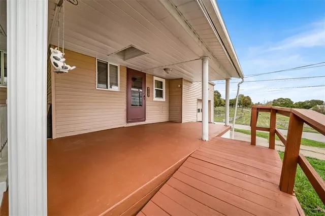 a balcony with wooden floor