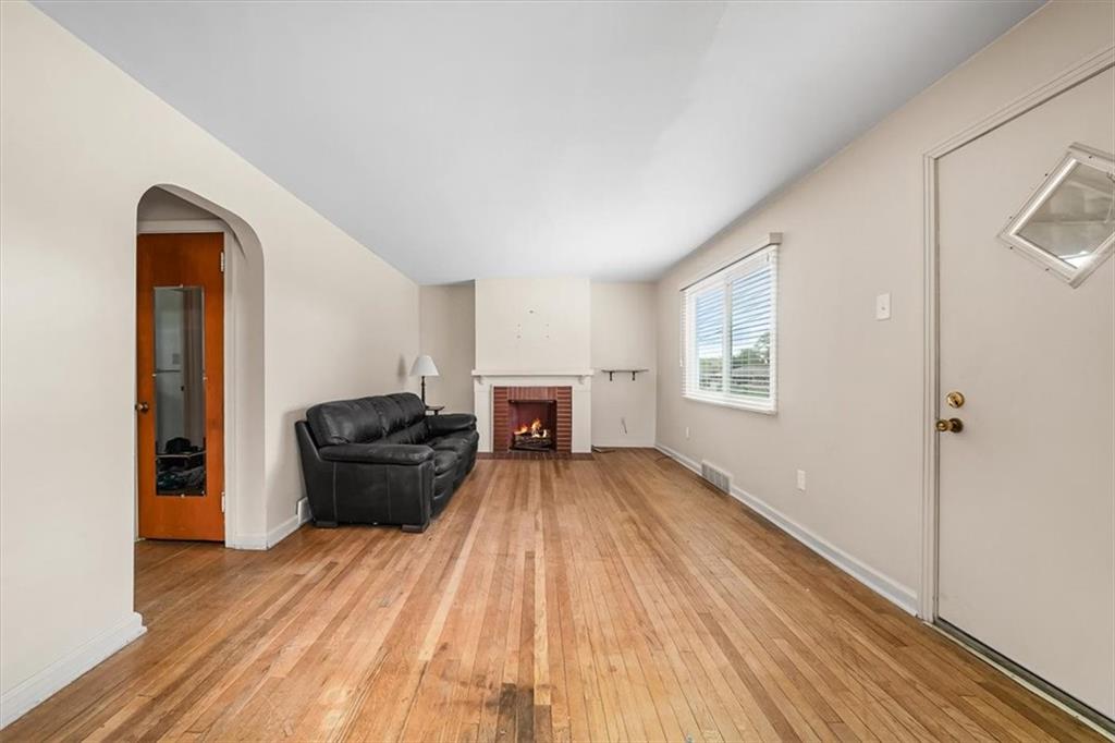 2164 Brodhead Road Aliquippa, PA 15001 - Photo 8 of 28 a view of a room with wooden floor air conditioner and windows