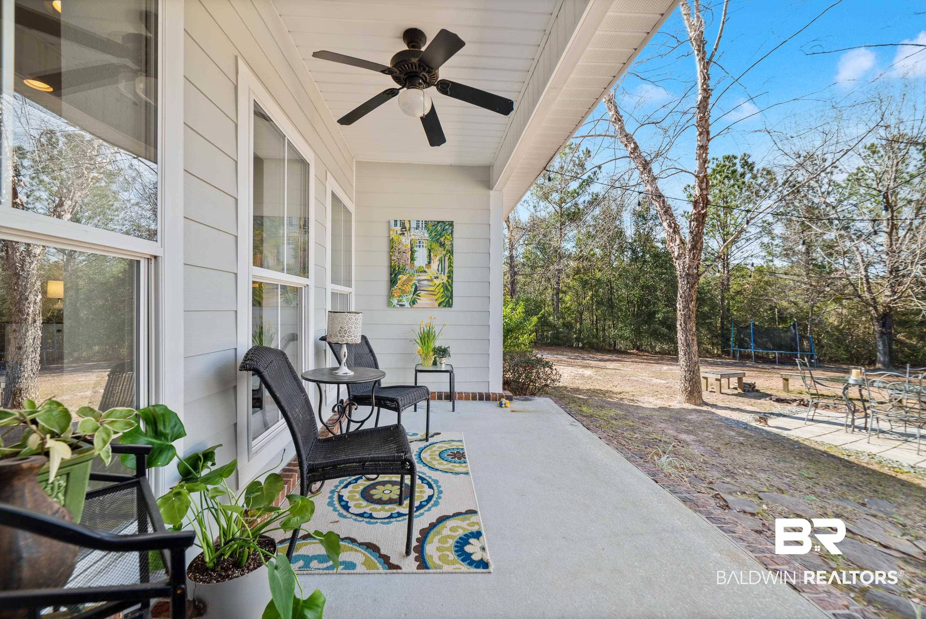 7875 Bromley Road Bay Minette, AL 36507 - Photo 32 of 39 patio looks towards the backyard and lake