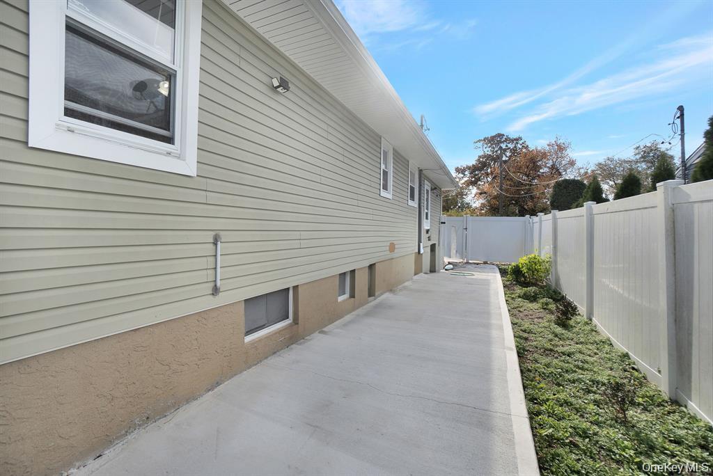 61 South Merrick Road Massapequa, NY 11758 - Photo 28 of 29 View of home's exterior with a fenced backyard