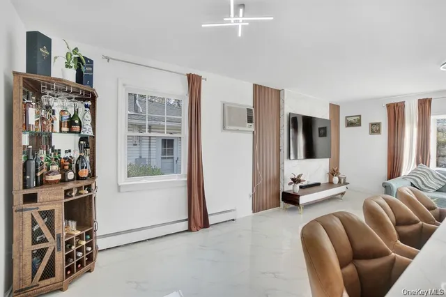 a living room with furniture and large window