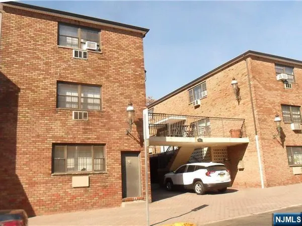 a front view of a house with outdoor space
