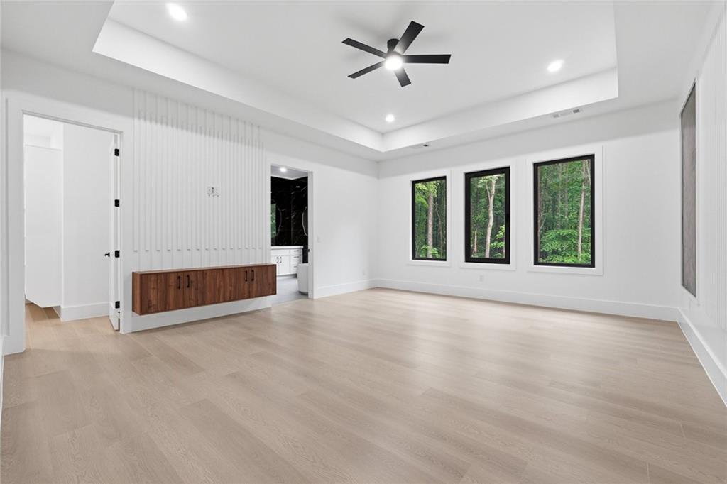 1563 Whitley Road Dacula, GA 30019 - Photo 16 of 44 a view of an empty room with a window and a ceiling fan