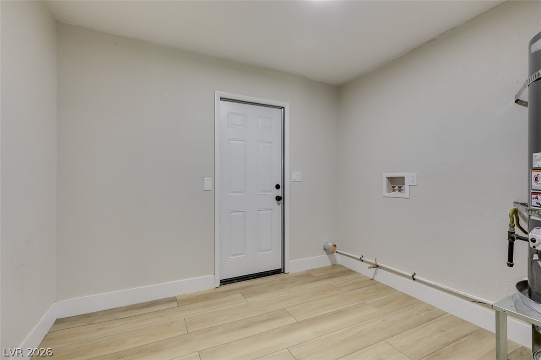 4036 Maple Hill Road Las Vegas, NV 89115 - Photo 29 of 43 Functional utility room with durable flooring and convenient laundry connections.