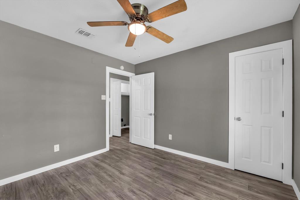 308 South Herman Street Mexia, TX 76667 - Photo 16 of 28 wooden floor in an empty room