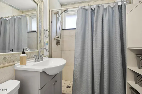 a bedroom with a bed and a television