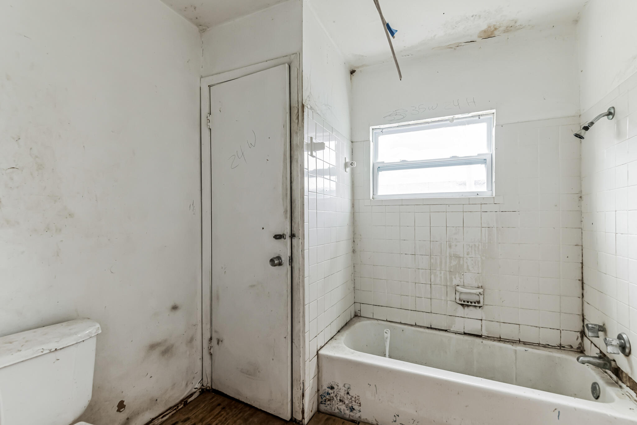 2511 Lipscomb Street Melbourne, FL 32901 - Photo 12 of 30 a white bath tub sitting next to a toilet