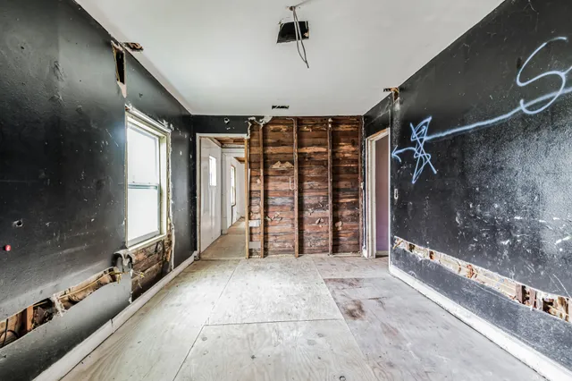 a view of an entryway with a floor to ceiling window and stairs