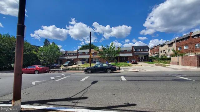 a view of street with parked cars