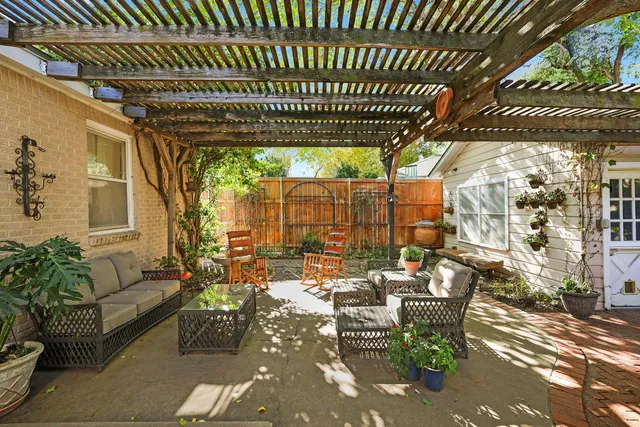 a outdoor living space with patio furniture and a potted plant