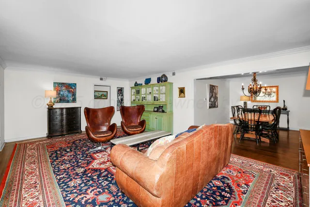 a bed room with a bed and a chair