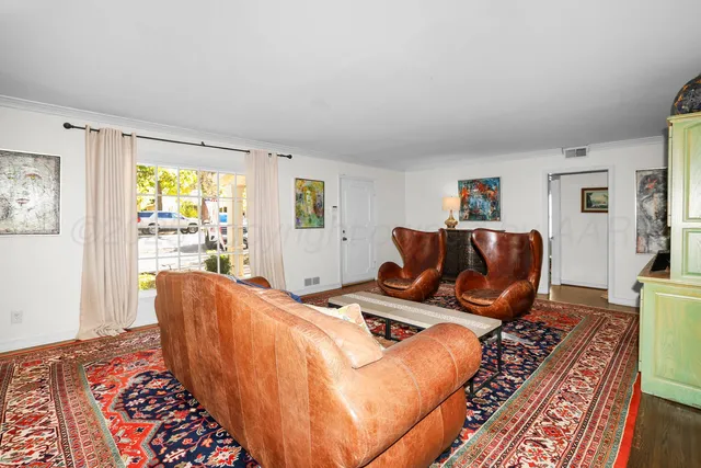 a bed room with furniture and a window