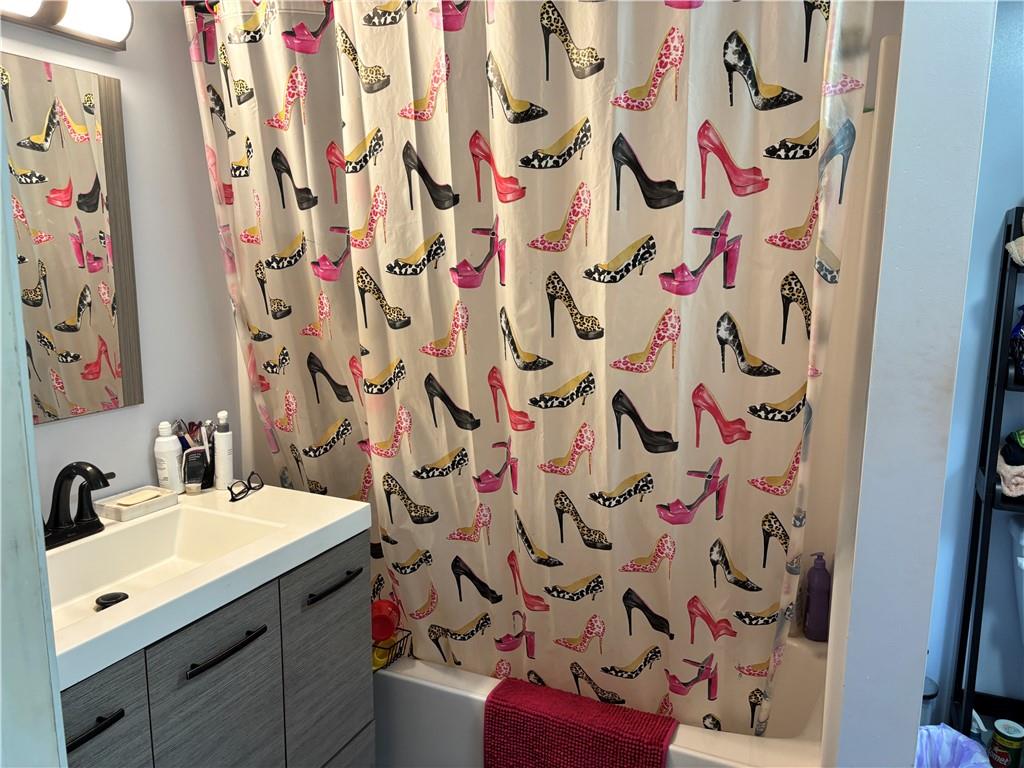 13008 Highway 286 Commodore, PA 15729 - Photo 16 of 23 a bathroom with a sink and mirror with shower curtain