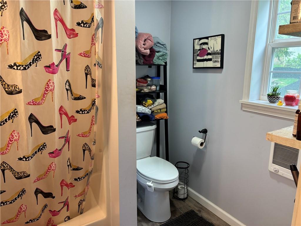 13008 Highway 286 Commodore, PA 15729 - Photo 17 of 23 a bathroom with a toilet and a shower curtain